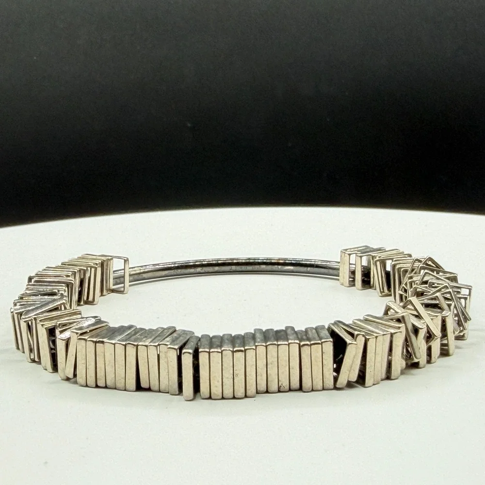 N/A sculptural silver